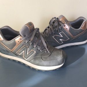 New Balance 574 Rose gold and grey sneakers.